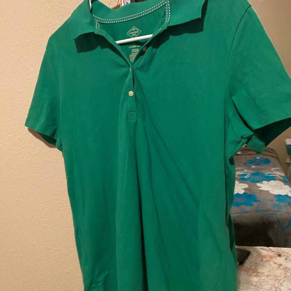 A light green st.John bay’s polo
